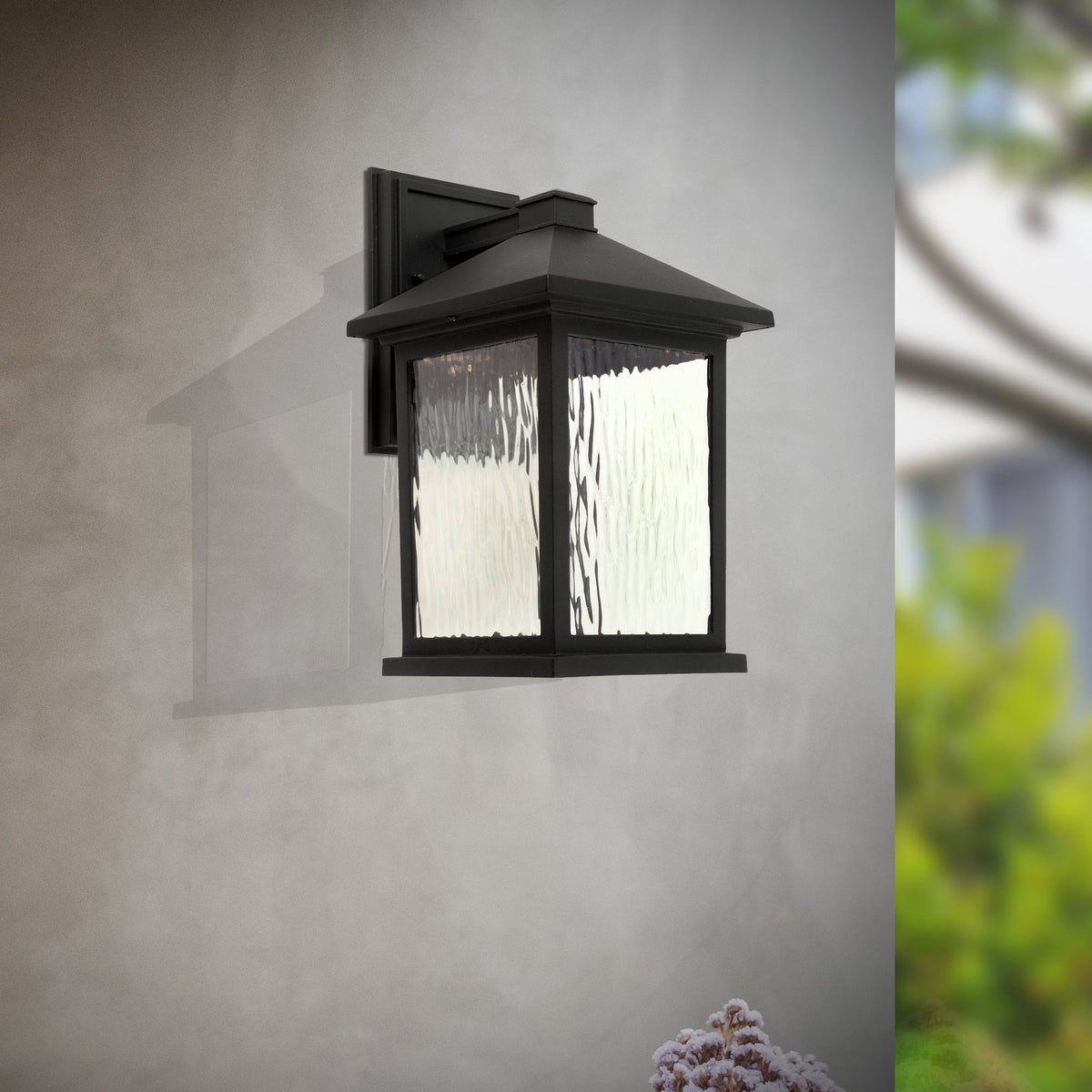 Forte Lighting Cardiff 8" 1-Light LED Die Cast Aluminum Black Outdoor Wall Light With Clear Water Glass Panels Shade