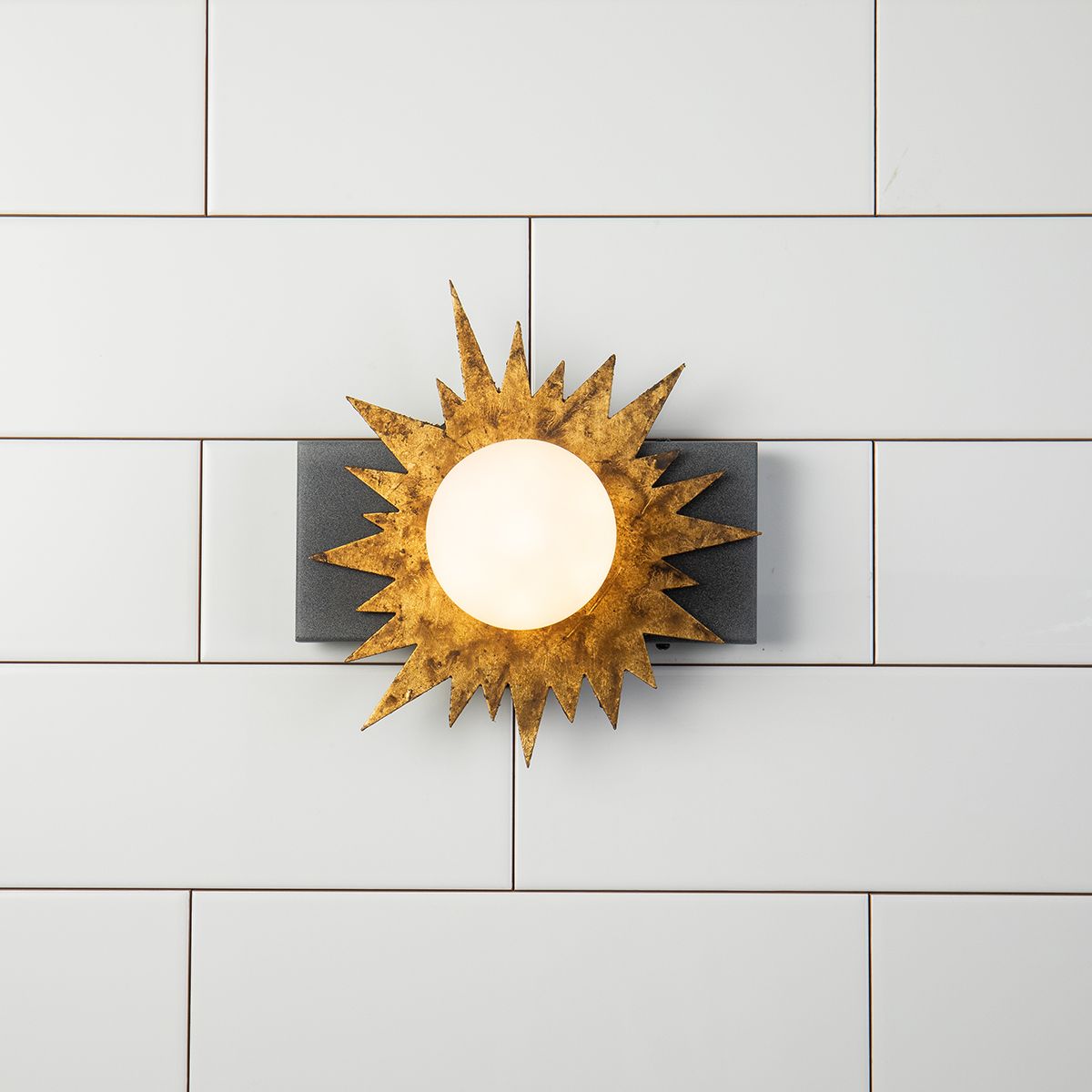 Lucas & McKearn Soleil 1-Light Weathered Zinc and Antique Gold Leaf Star-Shaped Wall Light With Sanded Glass Globe Shade
