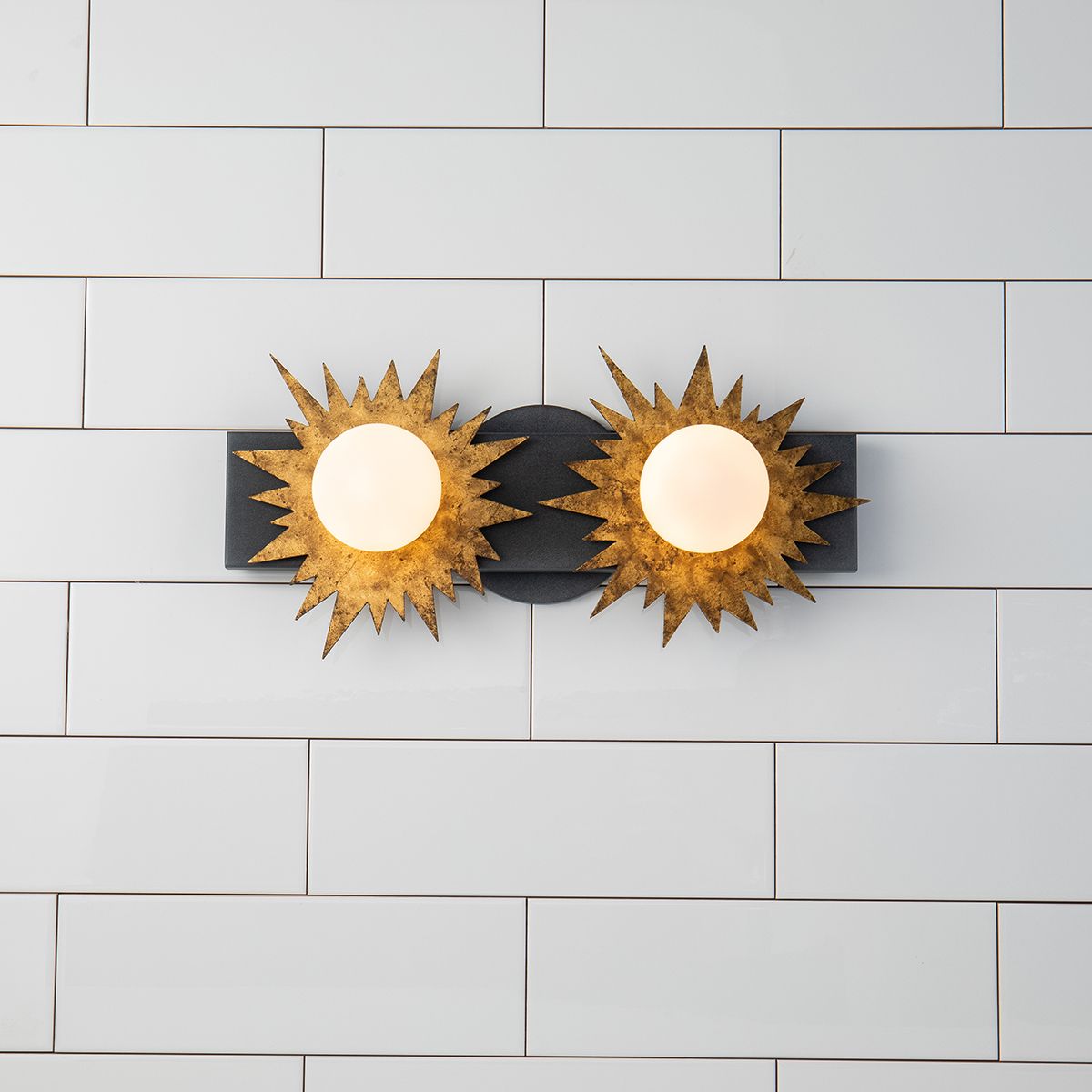 Lucas & McKearn Soleil 2-Light Weathered Zinc and Antique Gold Leaf Star-Shaped Wall Light With Sanded Glass Globe Shade