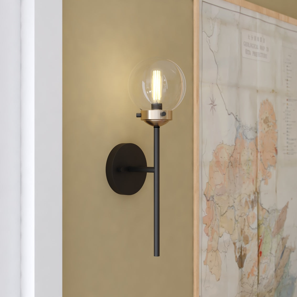 Vaxcel Orbit 1-Light Brass and Oil Rubbed Bronze Industrial MCM Wall Sconce Clear Glass Globe