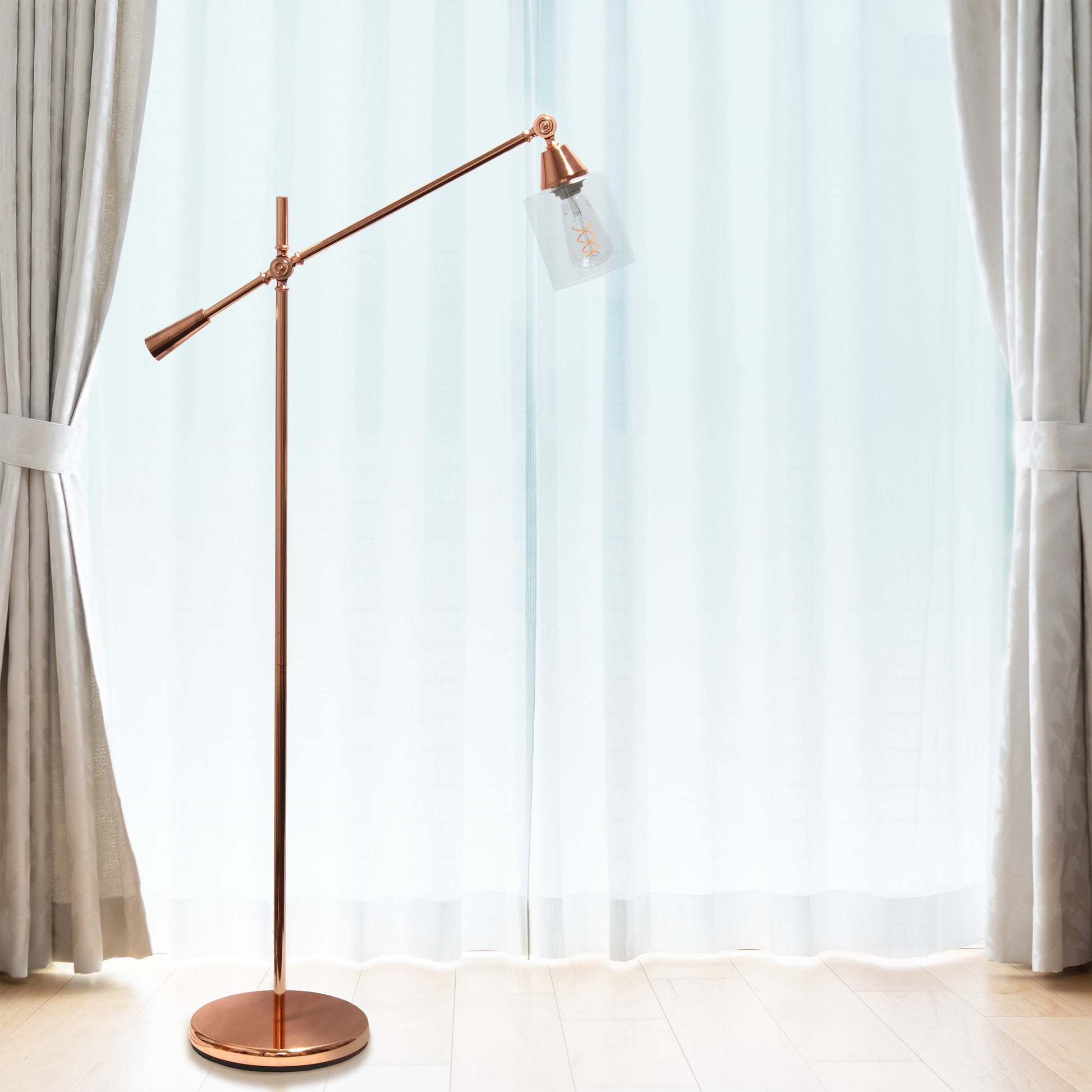 All The Rages Lalia Home Rose Gold Swing Arm Floor Lamp With Clear Glass Cylindrical Shade