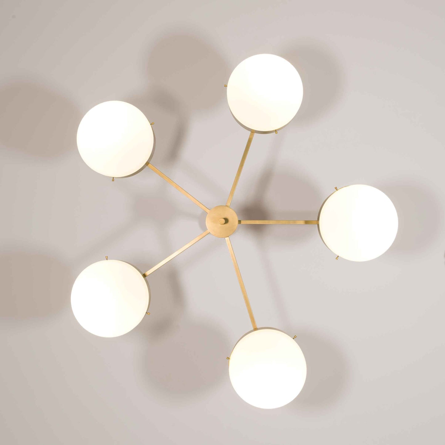 Design for Macha Celeste Luminescence Ceiling or Wall-Mounted Unpolished Balanced Five-Armed Brass Lamp