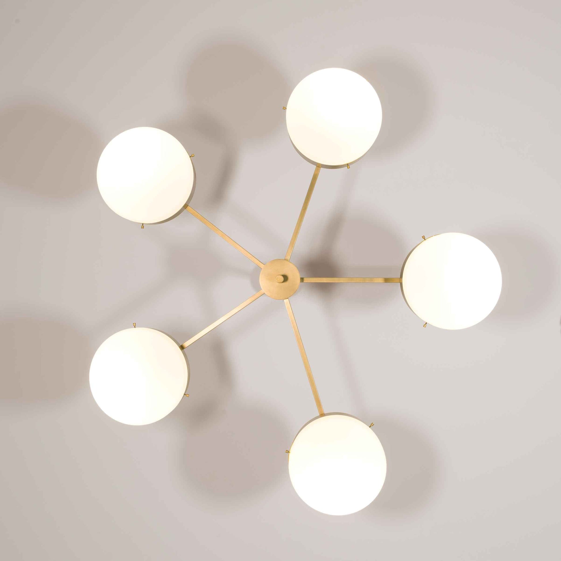 Design for Macha Celeste Luminescence Ceiling or Wall-Mounted Unpolished Lucid Five-Armed Brass Lamp