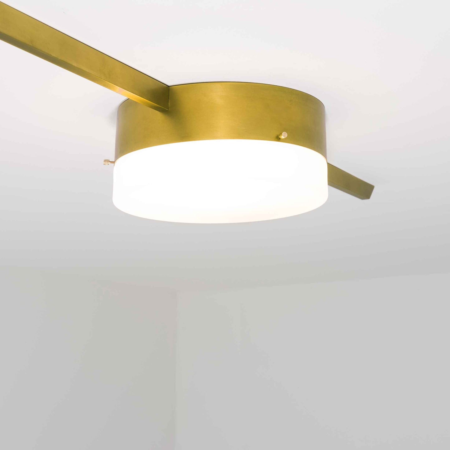 Design for Macha Celeste Solitude Ceiling or Wall-Mounted Unpolished Lucid One-Armed Brass Lamp