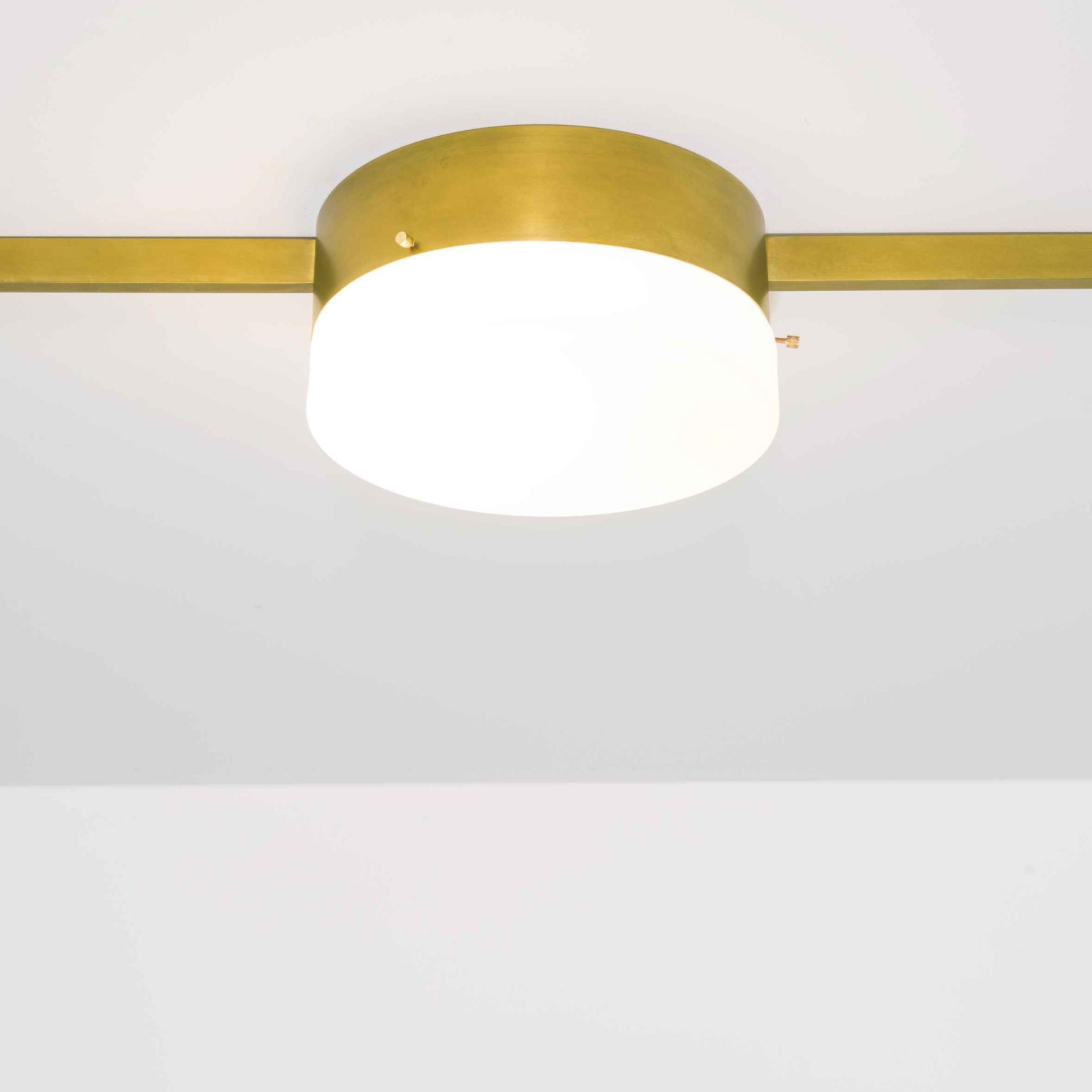 Design for Macha Celeste Solitude Ceiling or Wall-Mounted Unpolished Opaque One-Armed Brass Lamp