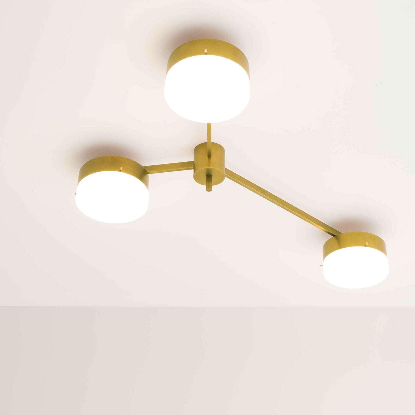 Design for Macha Celeste Syzygy Ceiling or Wall-Mounted Unpolished Balanced Three-Armed Brass Lamp
