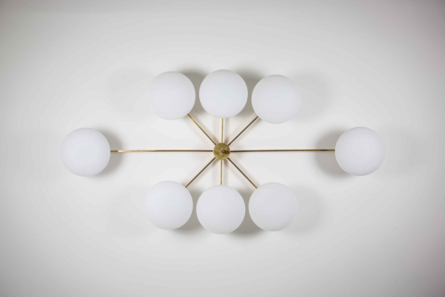Design for Macha Stella Evening Ceiling or Wall-Mounted Unpolished Lucid Eight-Armed Brass Lamp