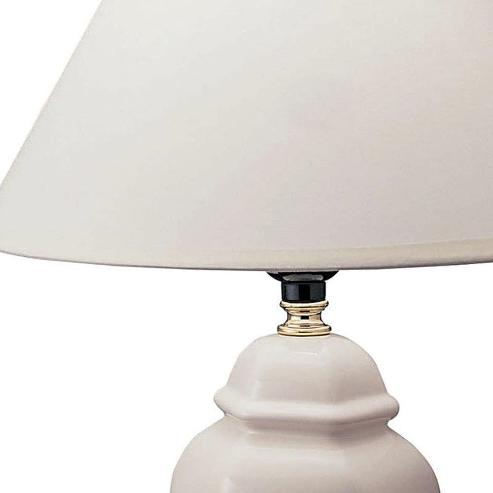 HomeRoots 13" White Ceramic Bedside Table Lamp With Off-White Shade