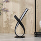 HomeRoots 17” Abstract Ribbon Metal Lamp With UV Light in Black Finish