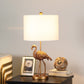HomeRoots 26” Resin Flamingo Table Lamp in Antiqued Gold Finish