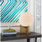 HomeRoots 37" Brass Metal Bedside Table With Off White Globe Shade