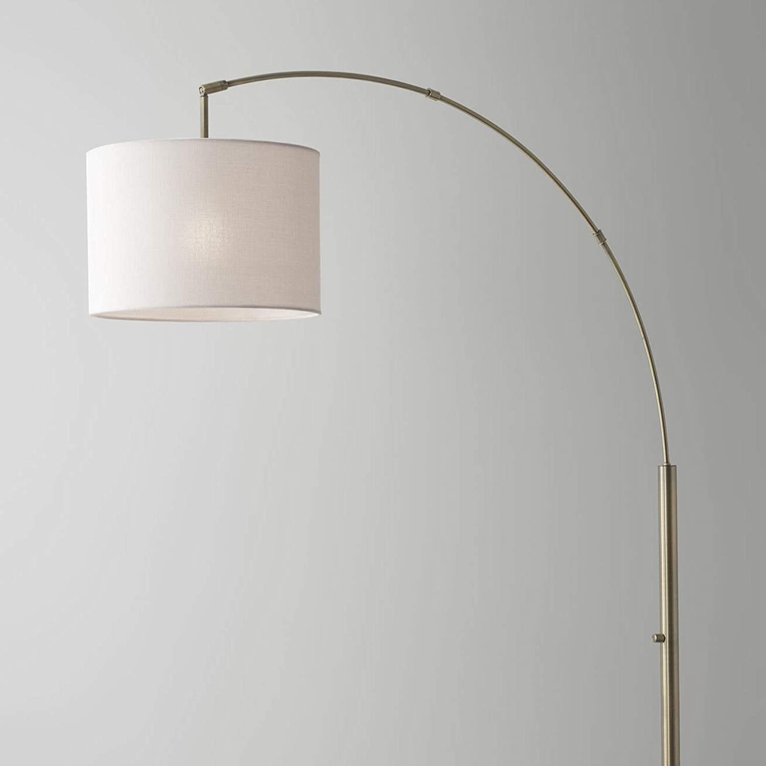 HomeRoots 74" Arc Floor Lamp With Off White Solid Color Drum Shade in Antique Brass Finish