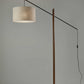 HomeRoots 77" Swing Arm Floor Lamp With Beige Drum Shade and Black Finish