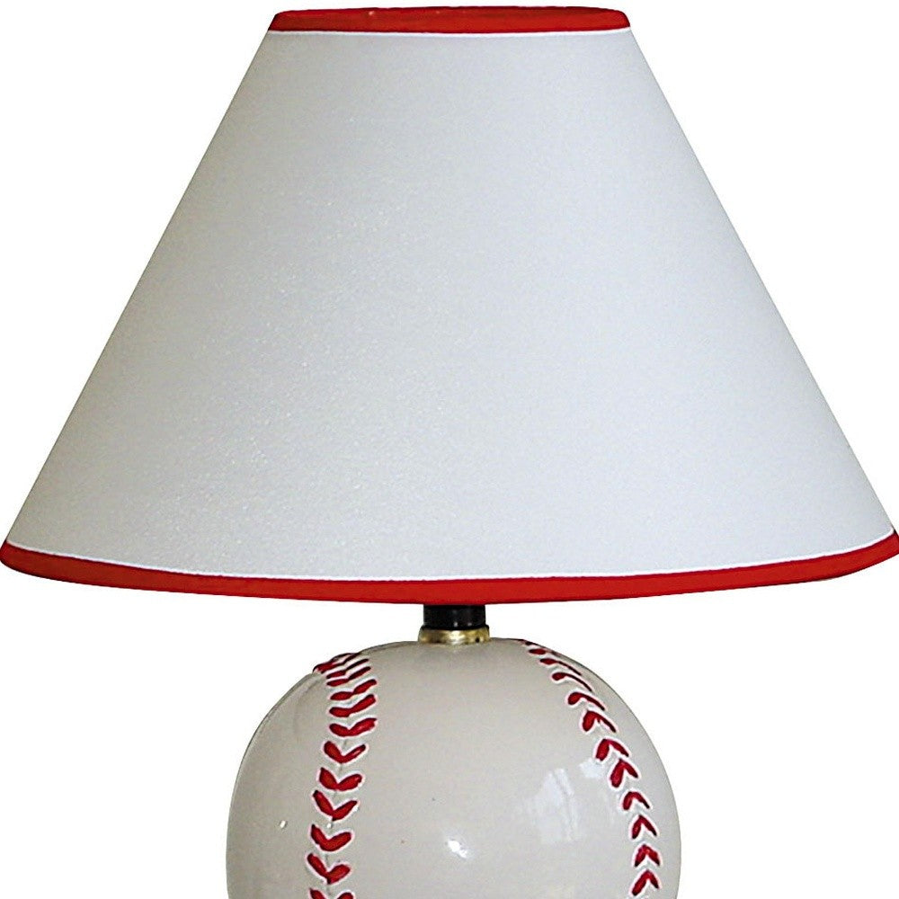 HomeRoots Ceramic Baseball Shaped Table Lamp With White Shade and Red Finish