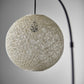 HomeRoots Floor Lamp With Bronze Metal Arc and Groovy Rattan String Ball Shade