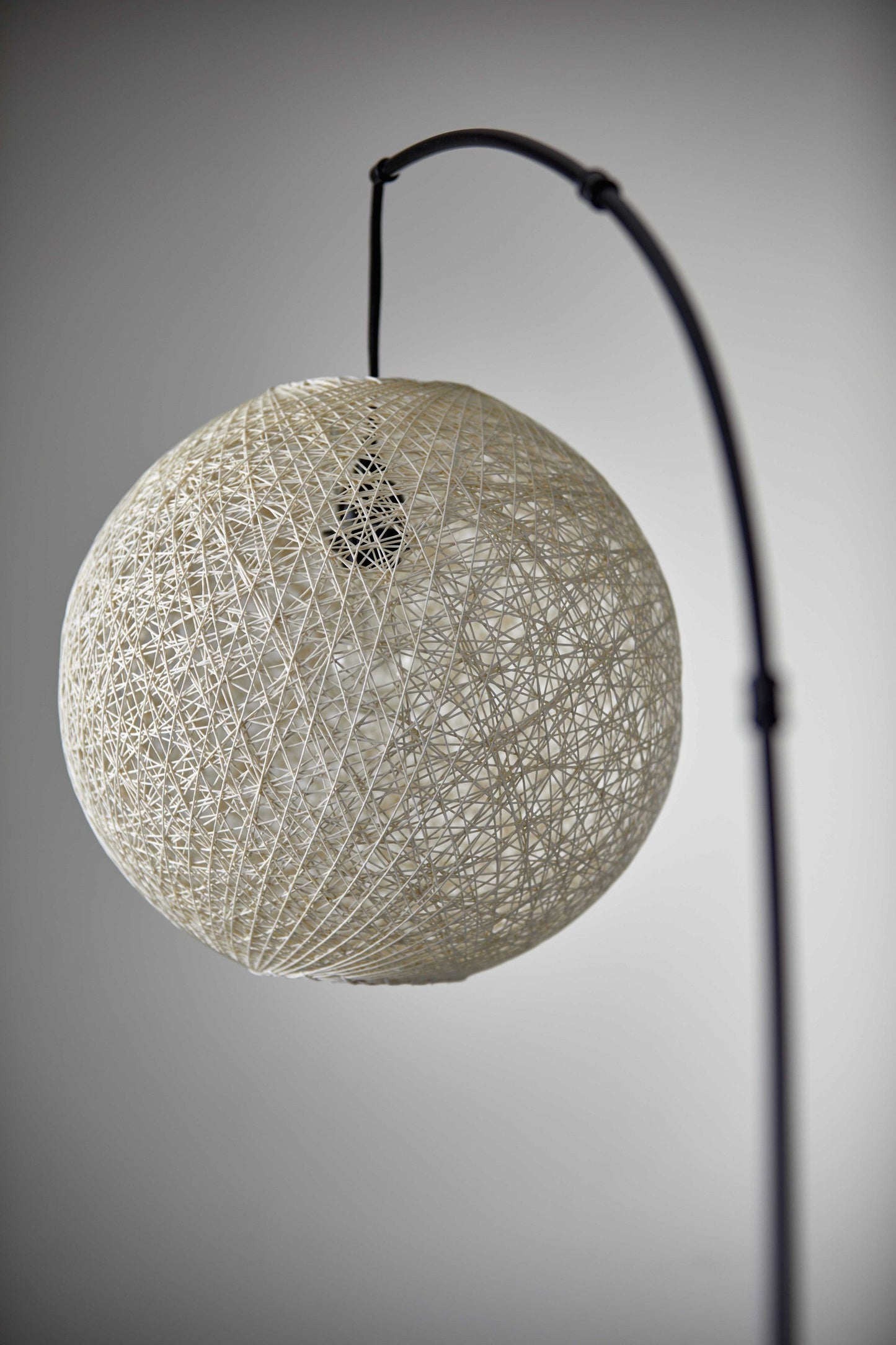 HomeRoots Floor Lamp With Bronze Metal Arc and Groovy Rattan String Ball Shade