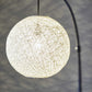 HomeRoots Floor Lamp With Bronze Metal Arc and Groovy Rattan String Ball Shade