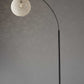 HomeRoots Floor Lamp With Bronze Metal Arc and Groovy Rattan String Ball Shade