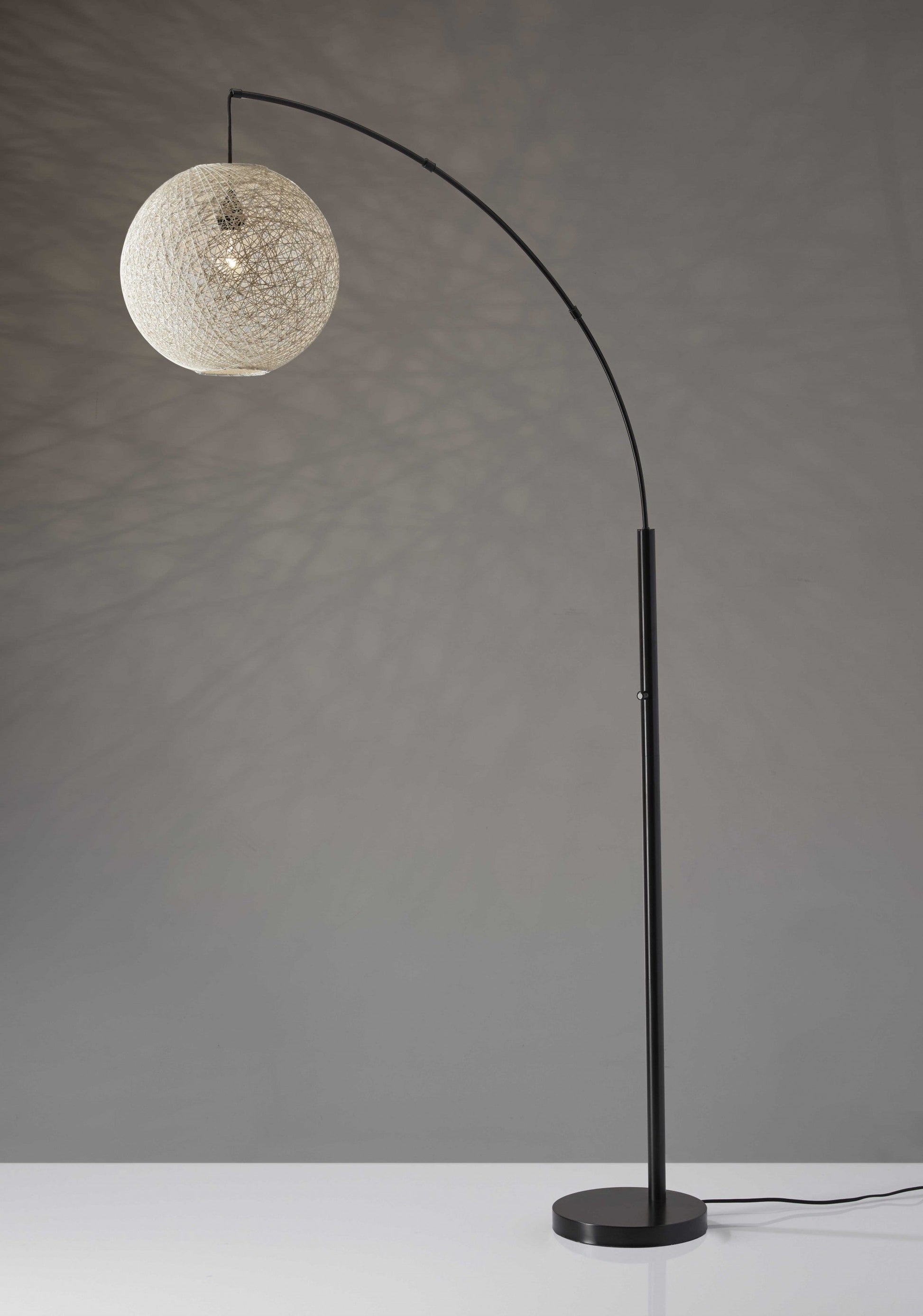 HomeRoots Floor Lamp With Bronze Metal Arc and Groovy Rattan String Ball Shade