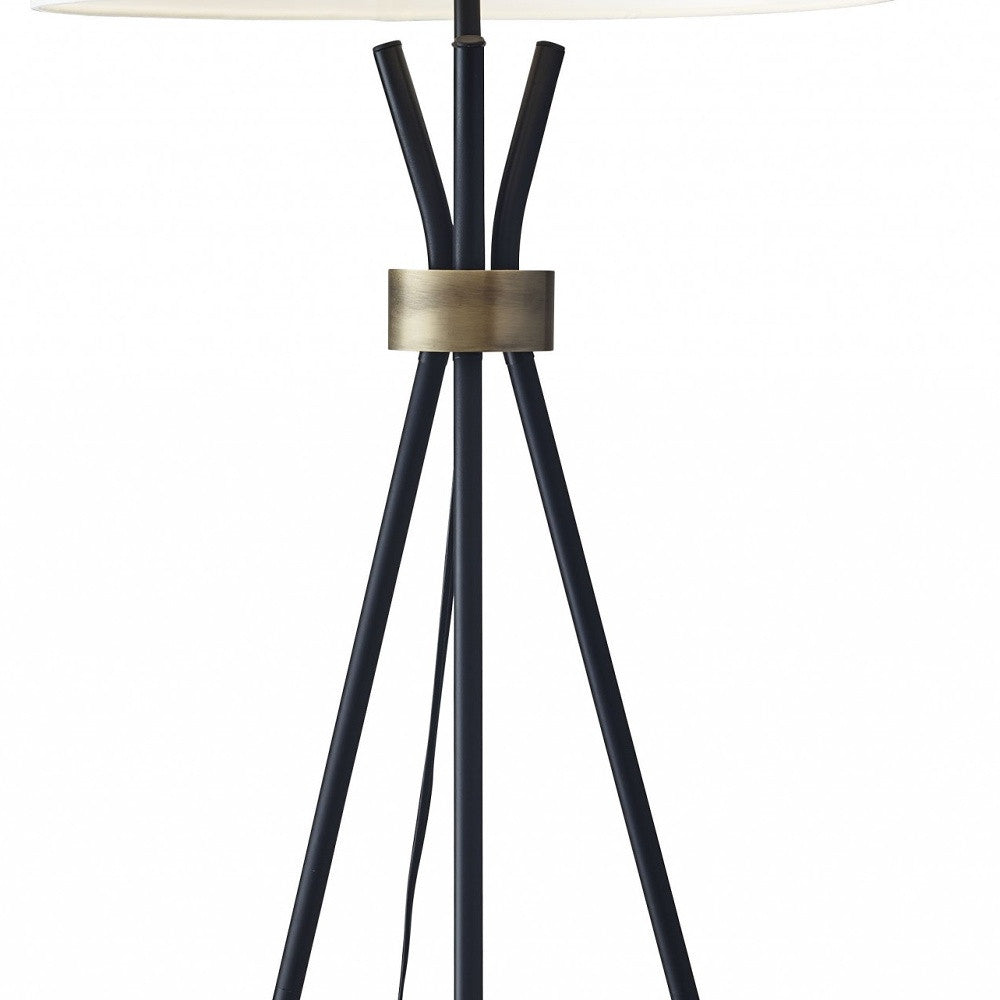 HomeRoots Metal Floor Lamp With Tripod Leg and Antique Brass Accent in Black Finish