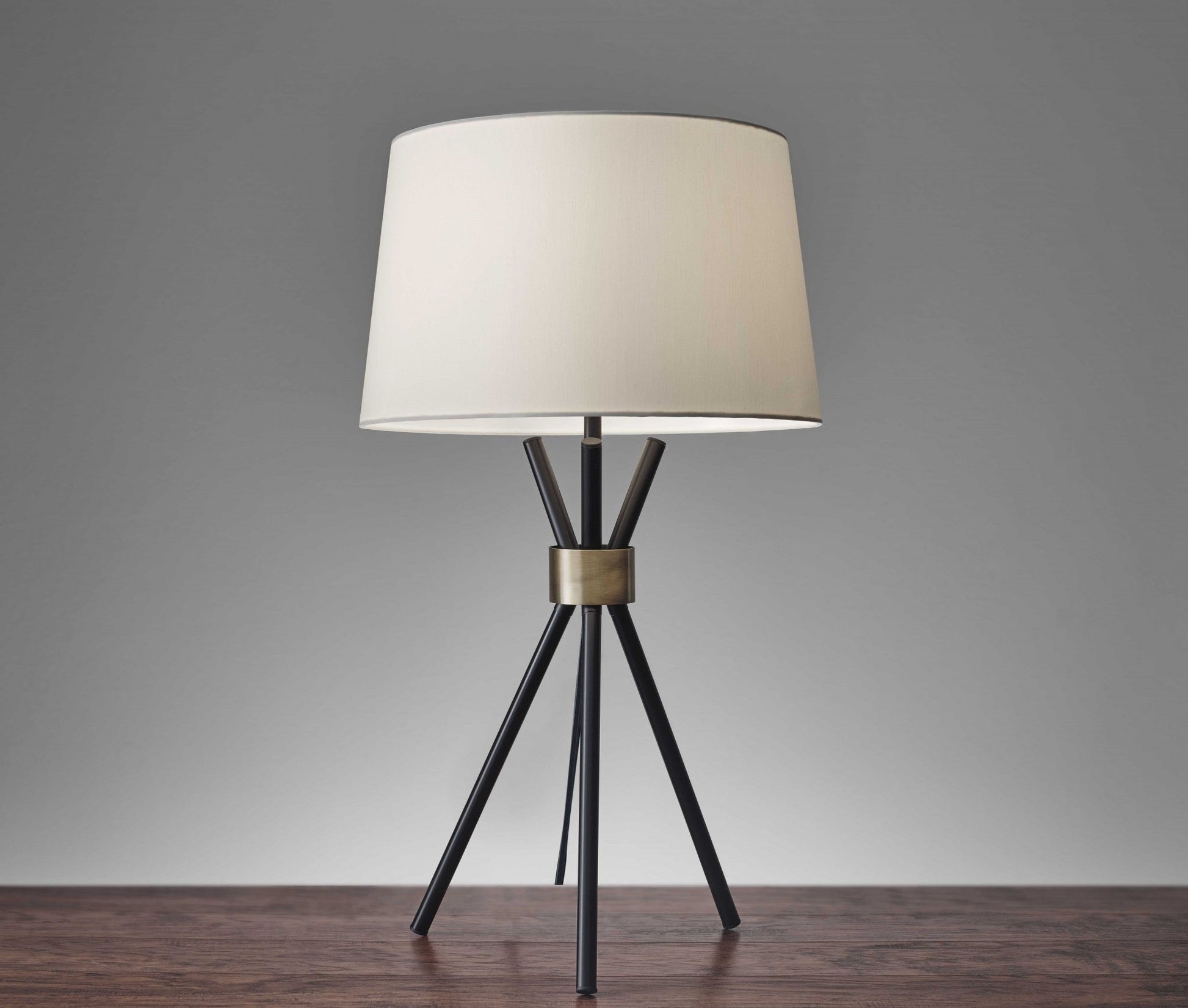HomeRoots Metal Tripod Leg in Black with Antique Brass Accent Table Lamp