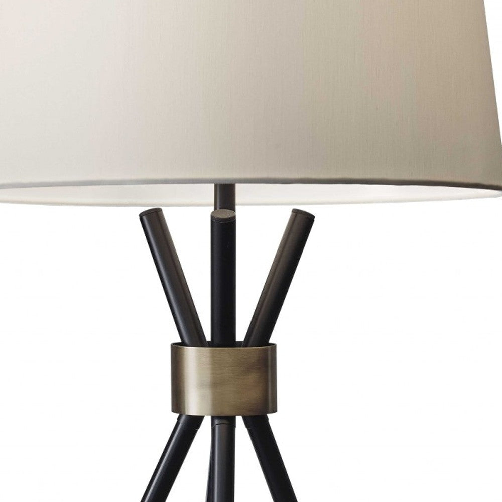HomeRoots Metal Tripod Leg in Black with Antique Brass Accent Table Lamp