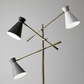 HomeRoots Three Arm Adjustable Floor Lamp in Brass Metal With Grey Black and White Shades