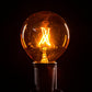Hometown Evolution G50 Transparent Orange Light Bulb with C9-E17 Base (Box of 25)