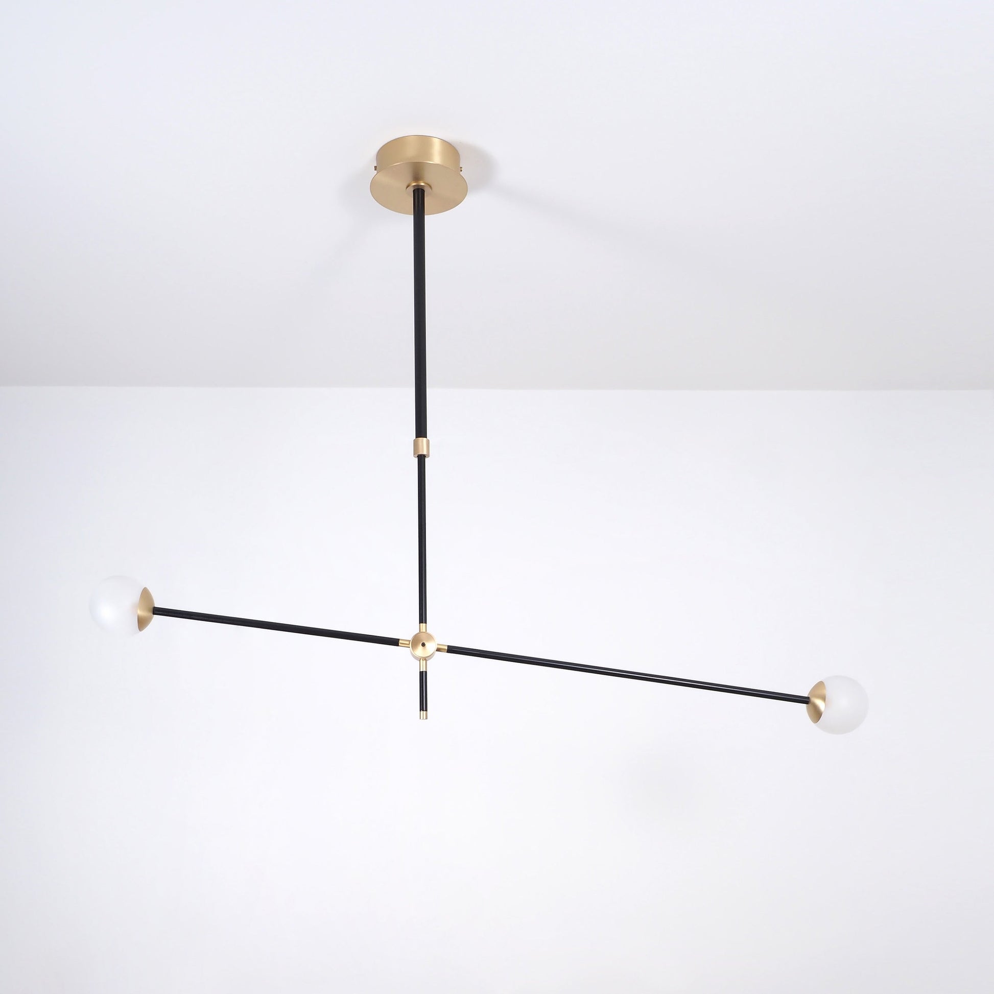 Intueri Light Bullarum 45" X 4" Brass or Copper Chandelier With Hand-Blowen Glass