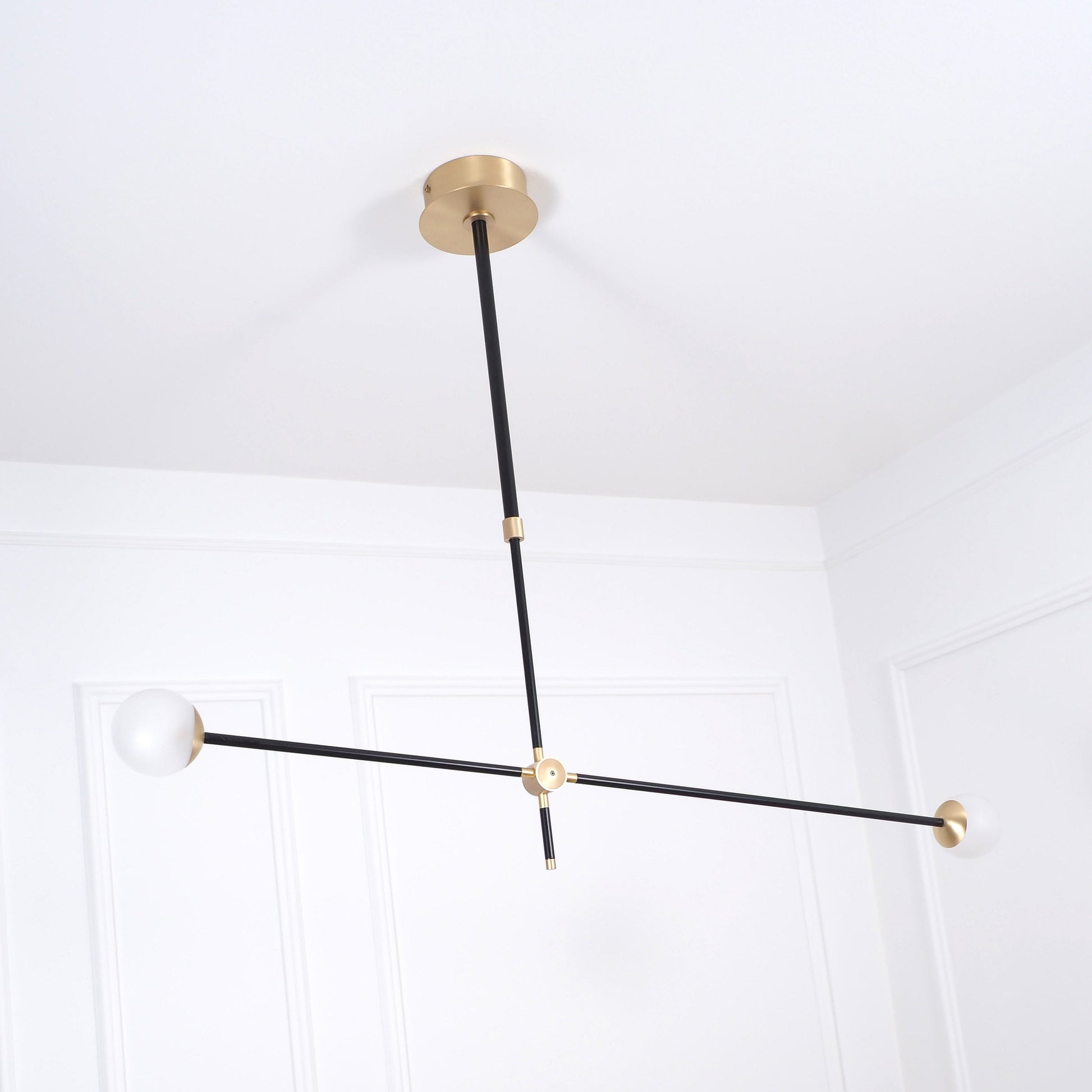 Intueri Light Bullarum 45" X 4" Brass or Copper Chandelier With Hand-Blowen Glass