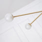 Intueri Light Bullarum 49" x 4" x (23" - 32") Brass or Copper Chandelier With Hand-Blowen Glass