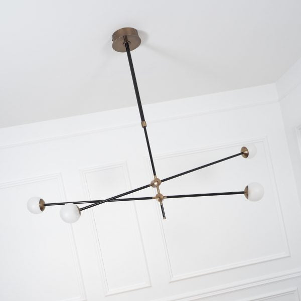 Intueri Light Bullarum 49" x 4" x (23" - 32") Brass or Copper Chandelier With Hand-Blowen Glass