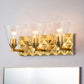 Lucas & McKearn Alpha 3-Light Aged Brass Wall Light With Cone Shape Clear Glass Shade