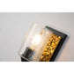Lucas & McKearn Bocage 1-Light Matte Black & Antique Gold Wall Light With Seeded Clear Glass Cylinder Shade