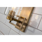 Lucas & McKearn Estes 1-Light Antique Brass Wall Light With Cylinder Shape Clear Glass Shade