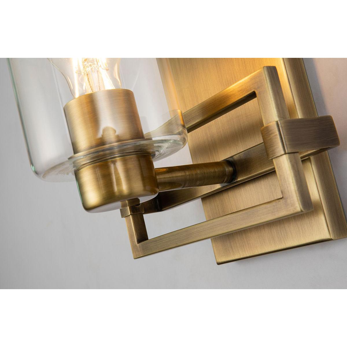 Lucas & McKearn Estes 1-Light Antique Brass Wall Light With Cylinder Shape Clear Glass Shade