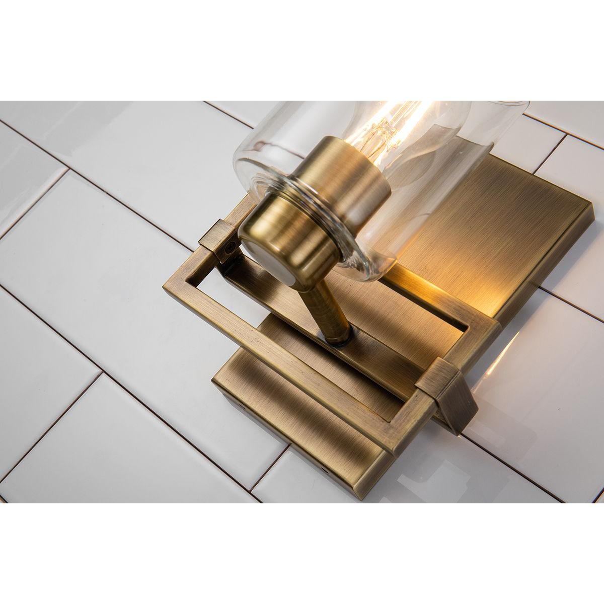 Lucas & McKearn Estes 1-Light Antique Brass Wall Light With Cylinder Shape Clear Glass Shade