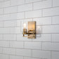 Lucas & McKearn Estes 1-Light Antique Brass Wall Light With Cylinder Shape Clear Glass Shade