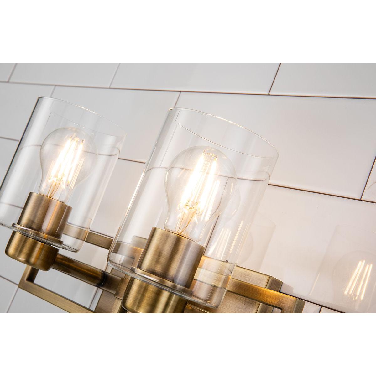 Lucas & McKearn Estes 2-Light Antique Brass Wall Light With Cylinder Shape Clear Glass Shade