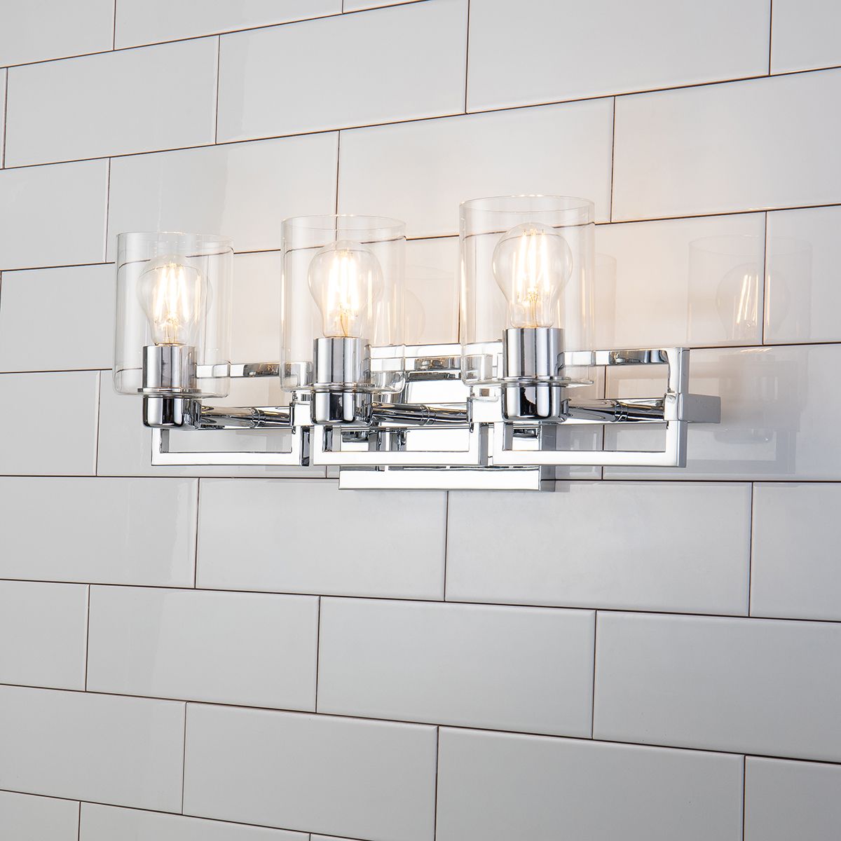 Lucas & McKearn Estes 3-Light Polished Chrome Wall Light With Cylinder Shape Clear Glass Shade