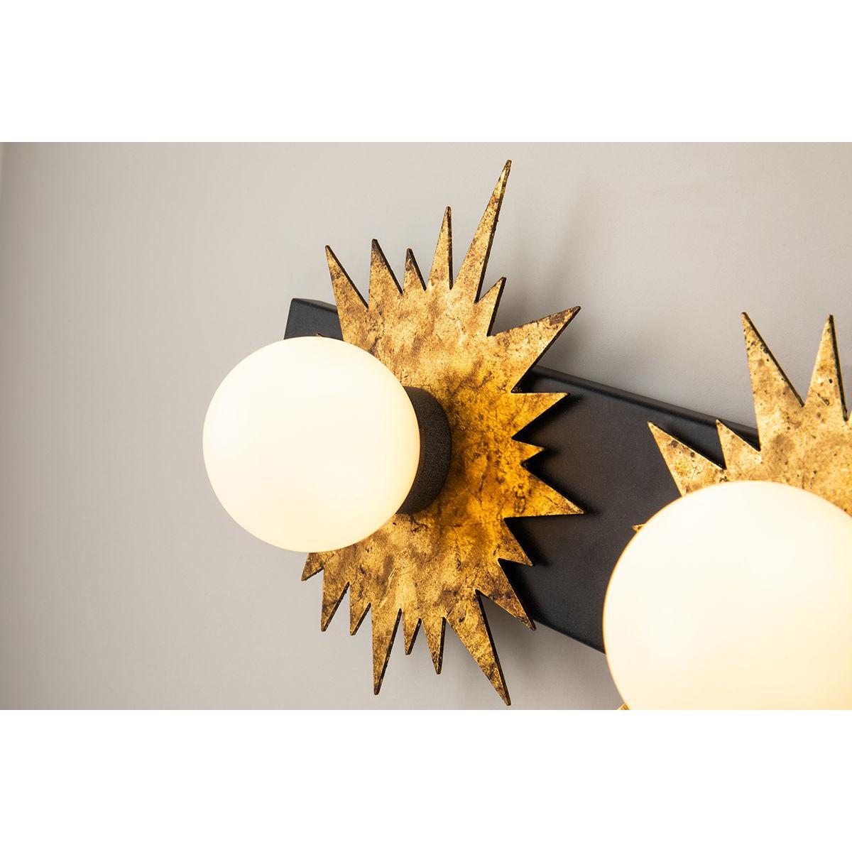 Lucas & McKearn Soleil 4-Light Weathered Zinc and Antique Gold Leaf Star-Shaped Wall Light With Sanded Glass Globe Shade