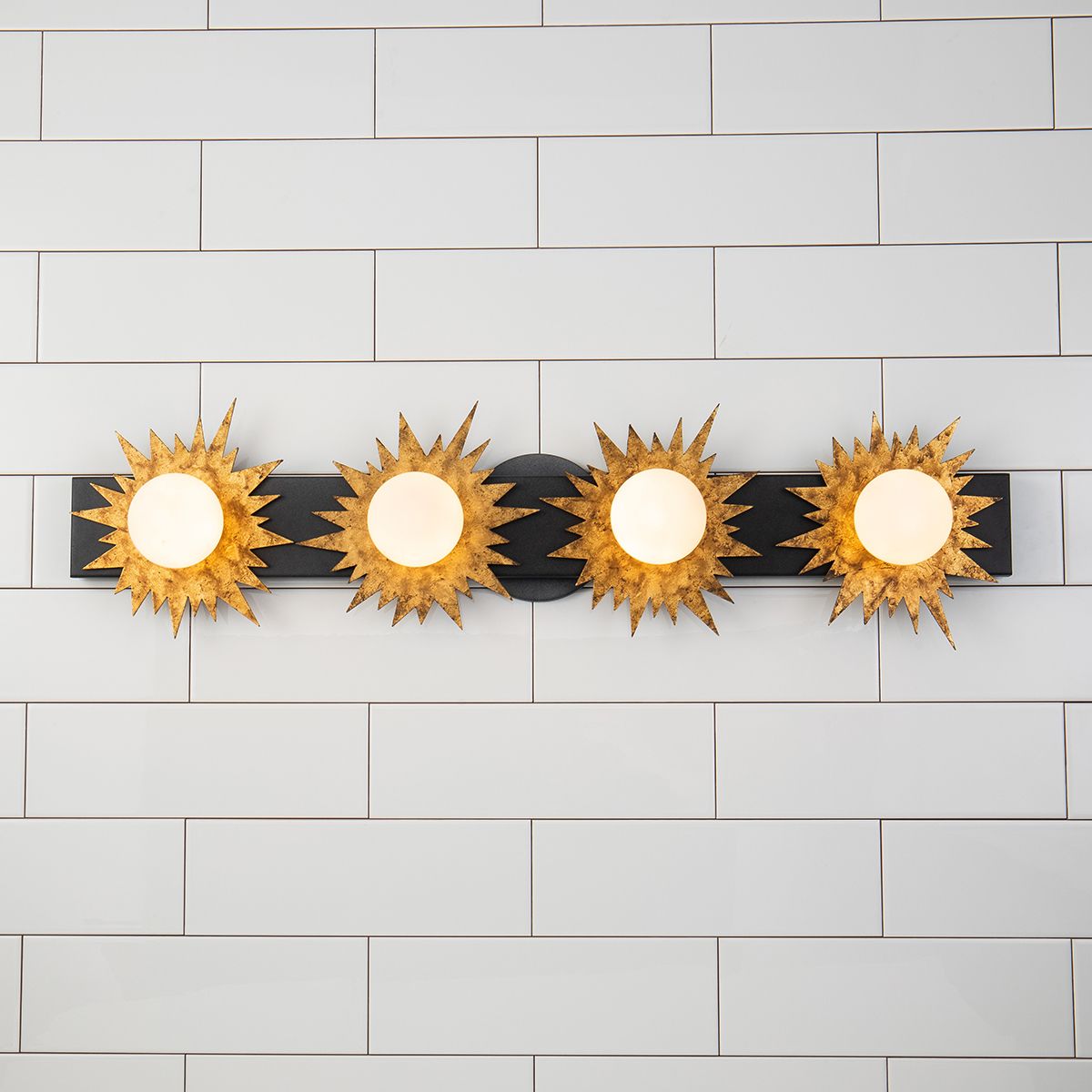 Lucas & McKearn Soleil 4-Light Weathered Zinc and Antique Gold Leaf Star-Shaped Wall Light With Sanded Glass Globe Shade