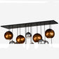 Meyda Lighting Bola 72" 15-Light Solar Black Metalica Cascading Pendant Light With Copper & Silver Shade