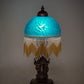 Meyda Lighting Roussillon 17" Mahogany Bronze Cherub Lantern Mini Table Lamp With Teal Shade Glass