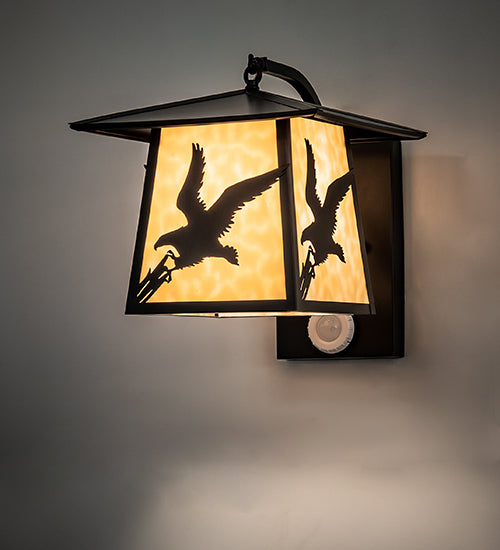 Meyda Lighting Stillwater 13" Solar Black Strike of the Eagle Wall Sconce With Beige Art Shade Glass