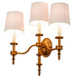 Meyda Lighting Toby 22" 3-Light Brass Tint Wall Sconce With Cream Textrene Shade