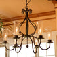 Stone County Ironworks Williamsburg Carriage 30" 6 Arm Hand Rubbed Ivory Iron Chandelier With Gold Iron Accent and Amber Drip Cover