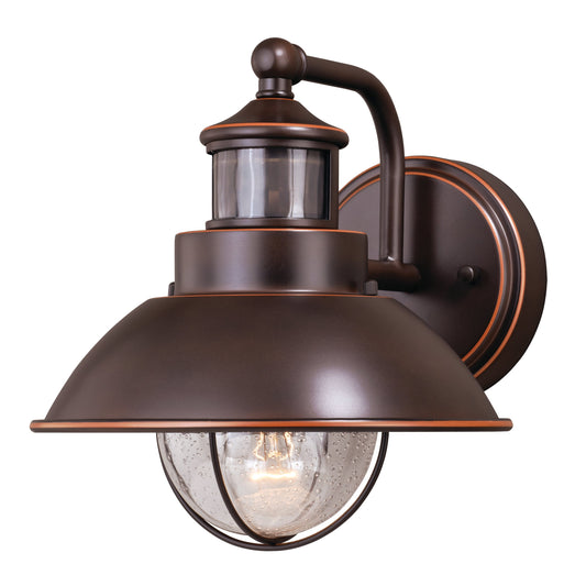 Vaxcel Harwich 8" 1-Light Burnished Bronze Motion Sensor Dusk-to-Dawn Outdoor Wall Light With Clear Seeded Glass Shade