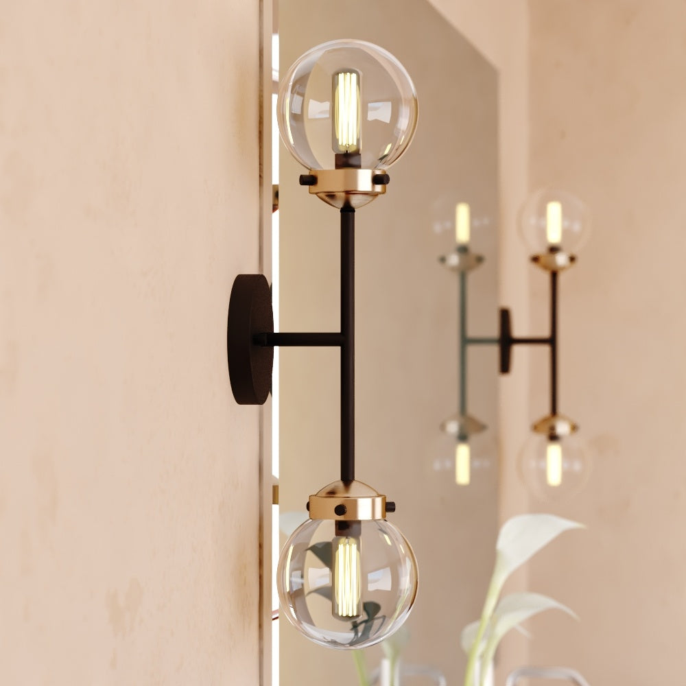Vaxcel Orbit 2-Light Brass and Oil Rubbed Bronze Industrial MCM Wall Sconce Clear Glass Globe