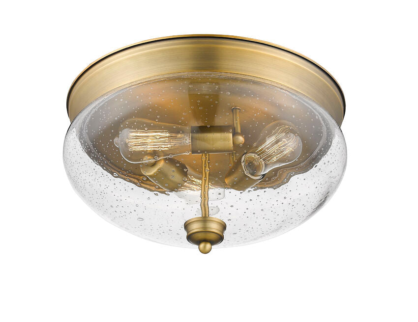 Z-Lite Amon 15" 3-Light Heritage Brass Flush Mount Lighting With Clear Seedy Glass Shade